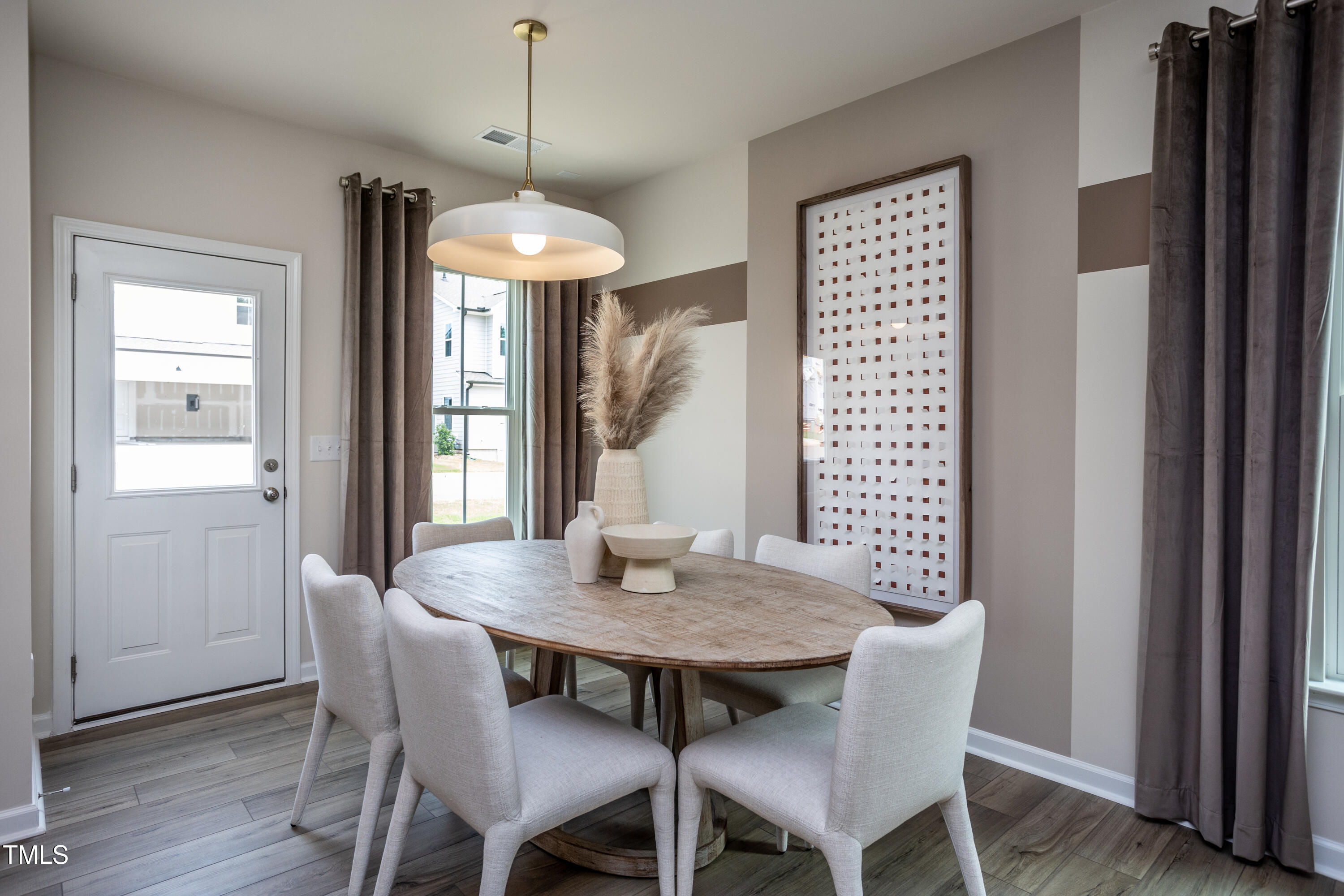 246 Broomside Avenue Raleigh, NC 27603 - Photo 6 of 24 a view of a dining room with furniture window and wooden floor
