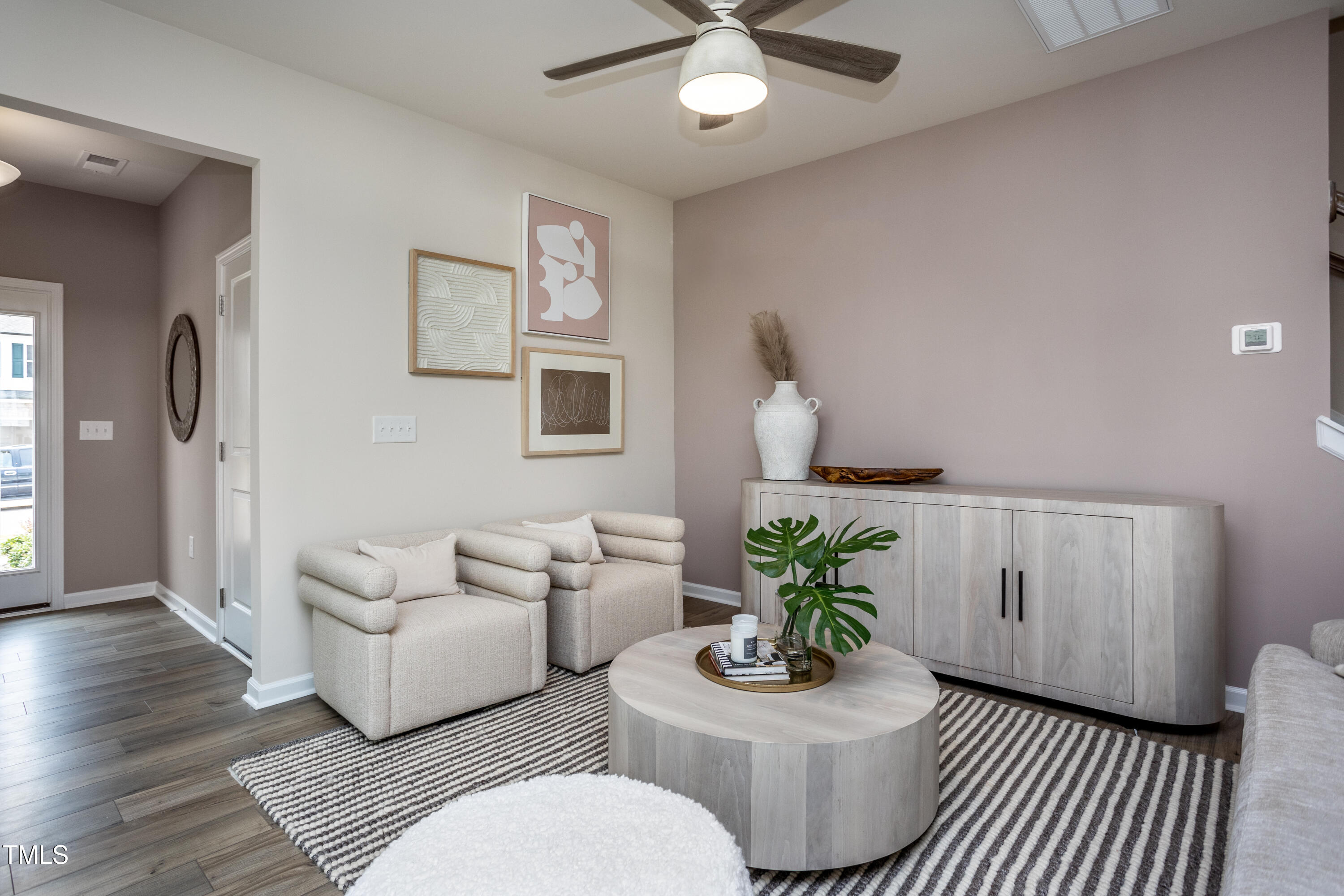 246 Broomside Avenue Raleigh, NC 27603 - Photo 7 of 24 a living room with furniture flowerpot and wooden floor