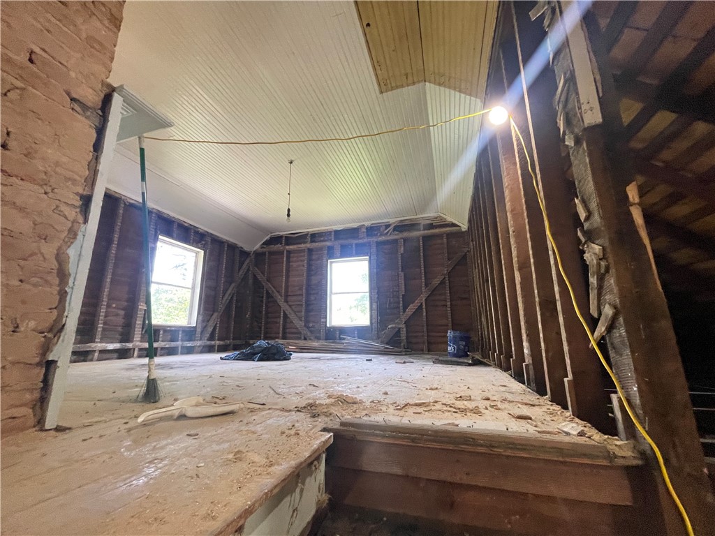 171 River Ridge Road Seneca, SC 29672 - Photo 13 of 22 A promising attic space with exposed wood framing awaits transformation into functional living areas.