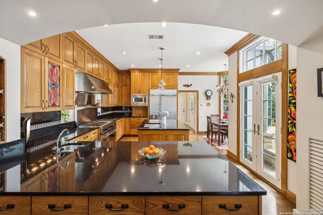a view of a living room and kitchen