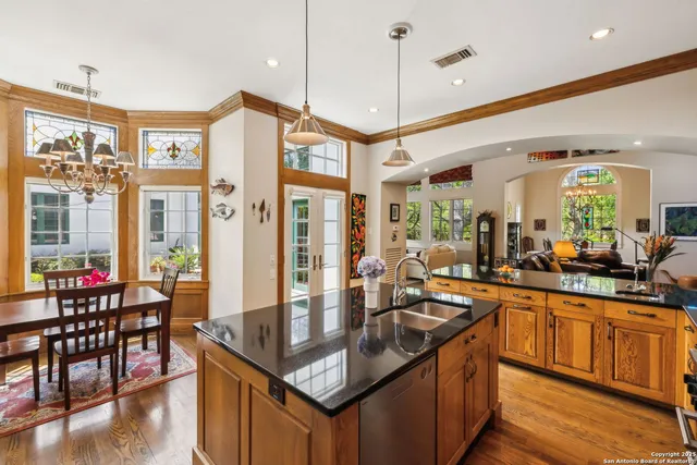 a kitchen with stainless steel appliances granite countertop a stove and refrigerator