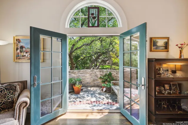 a view of livingroom with furniture and floor to ceiling window
