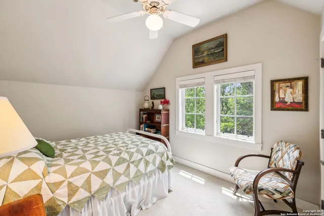 a bedroom with a bed and a chair