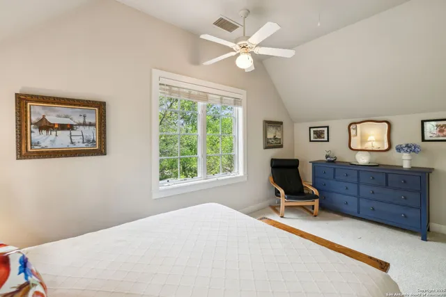 a bed room with a bed and a window