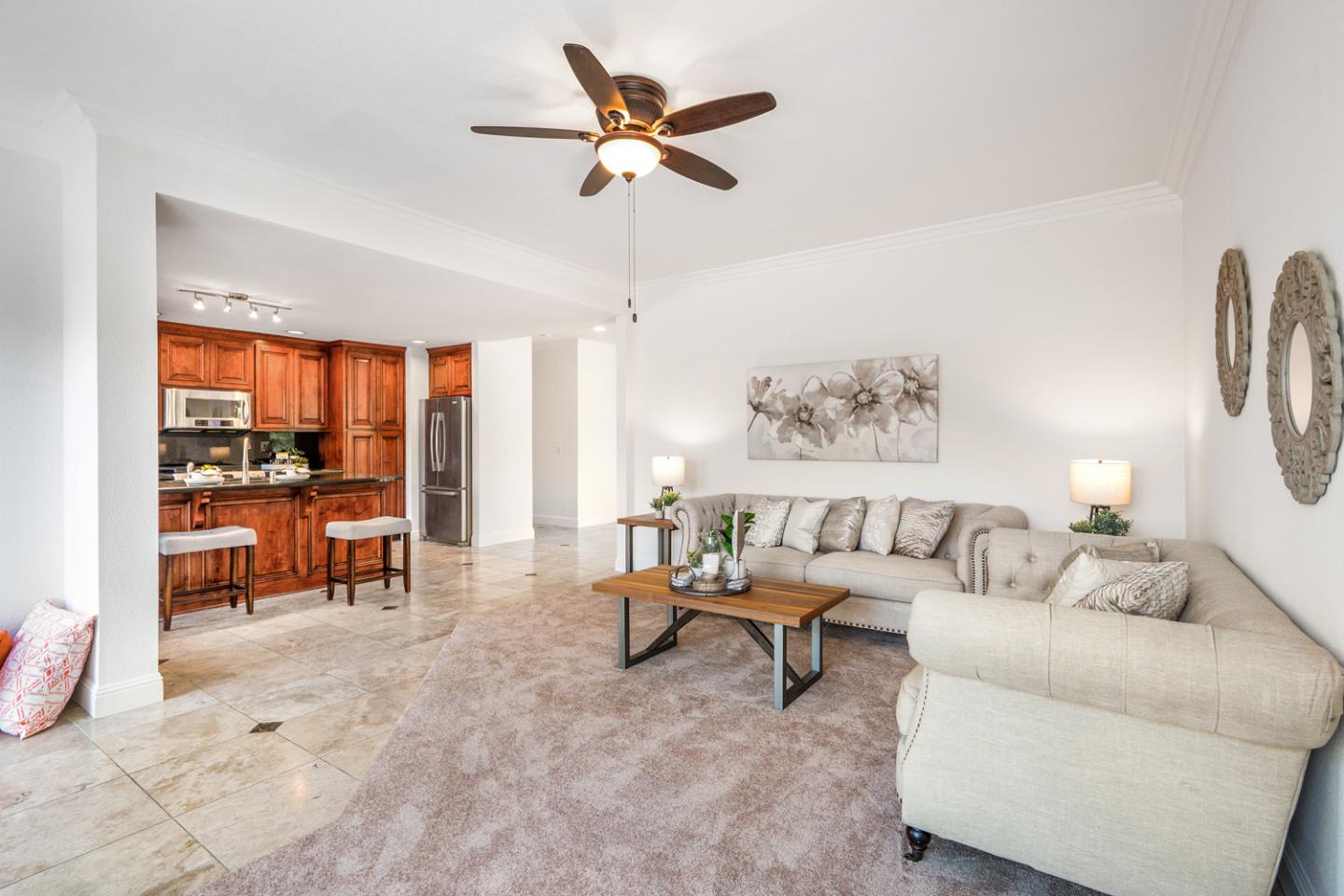 9040 Ridgeway Drive Gilroy, CA 95020 - Photo 16 of 44 a living room with furniture and a large window with garden view