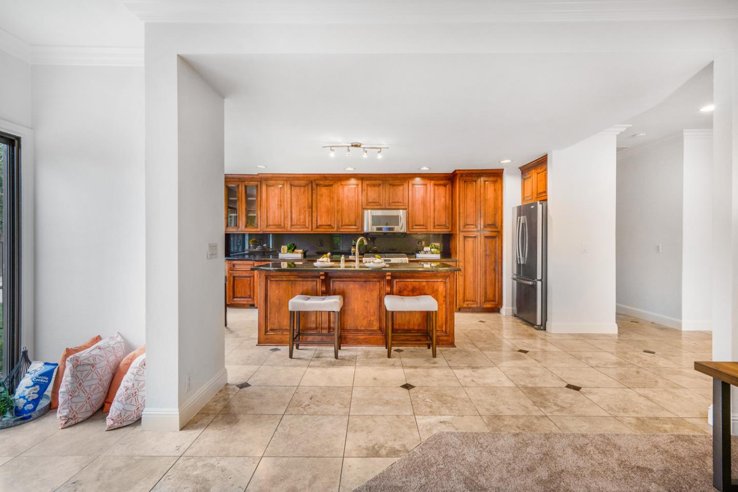 9040 Ridgeway Drive Gilroy, CA 95020 - Photo 17 of 44 a view of open kitchen with dining table and chairs