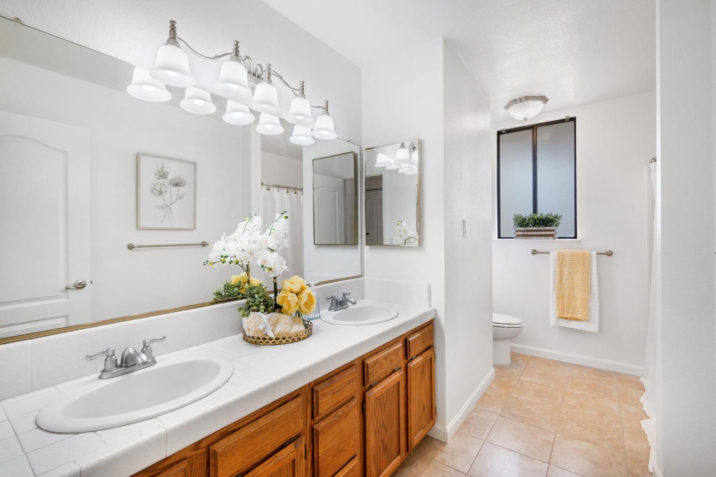 9040 Ridgeway Drive Gilroy, CA 95020 - Photo 21 of 44 a bathroom with a sink vanity and mirror