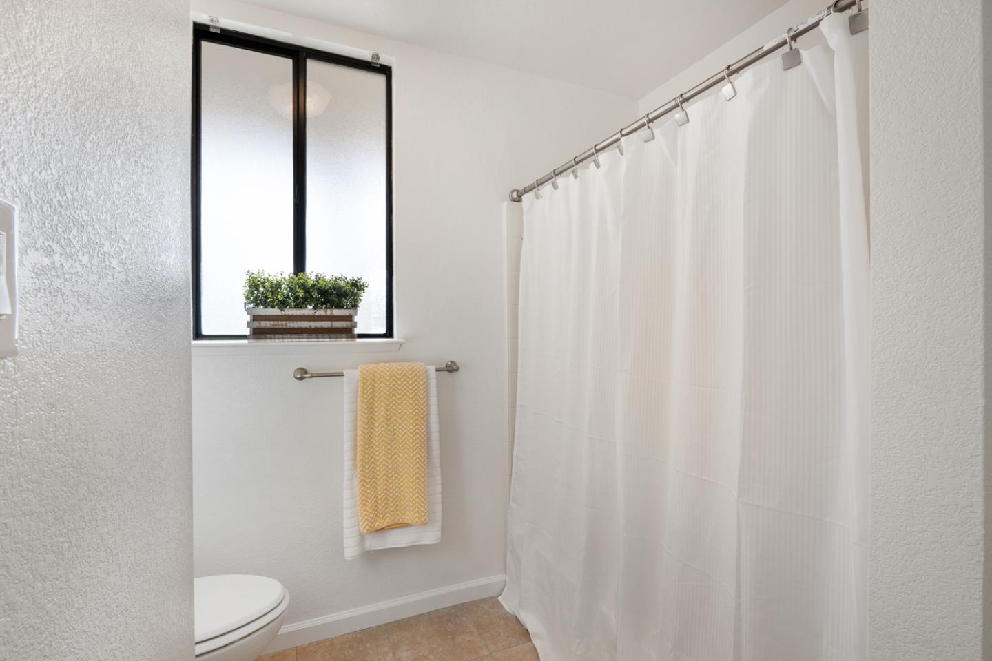 9040 Ridgeway Drive Gilroy, CA 95020 - Photo 22 of 44 a bathroom with a sink and a mirror