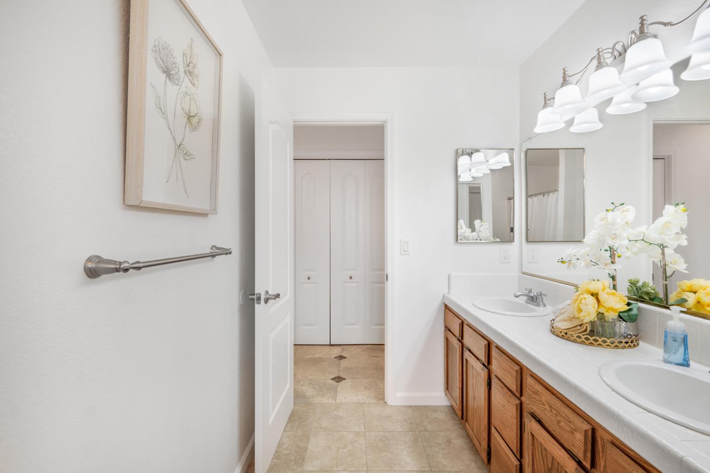 9040 Ridgeway Drive Gilroy, CA 95020 - Photo 23 of 44 a spacious bathroom with a sink a vanity and a mirror