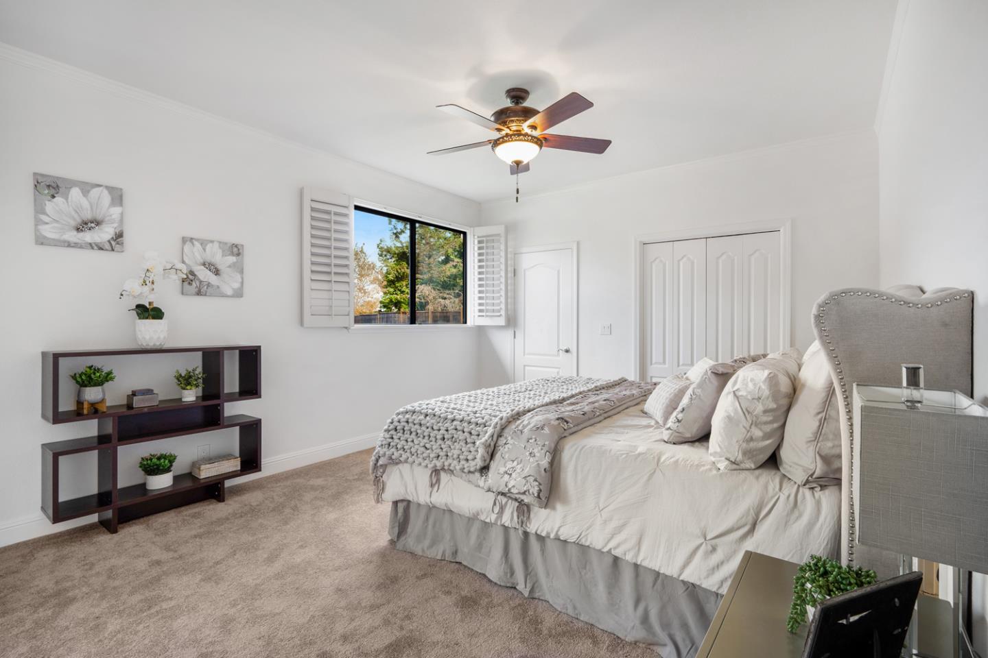 9040 Ridgeway Drive Gilroy, CA 95020 - Photo 26 of 44 a bedroom with a bed and a chandelier