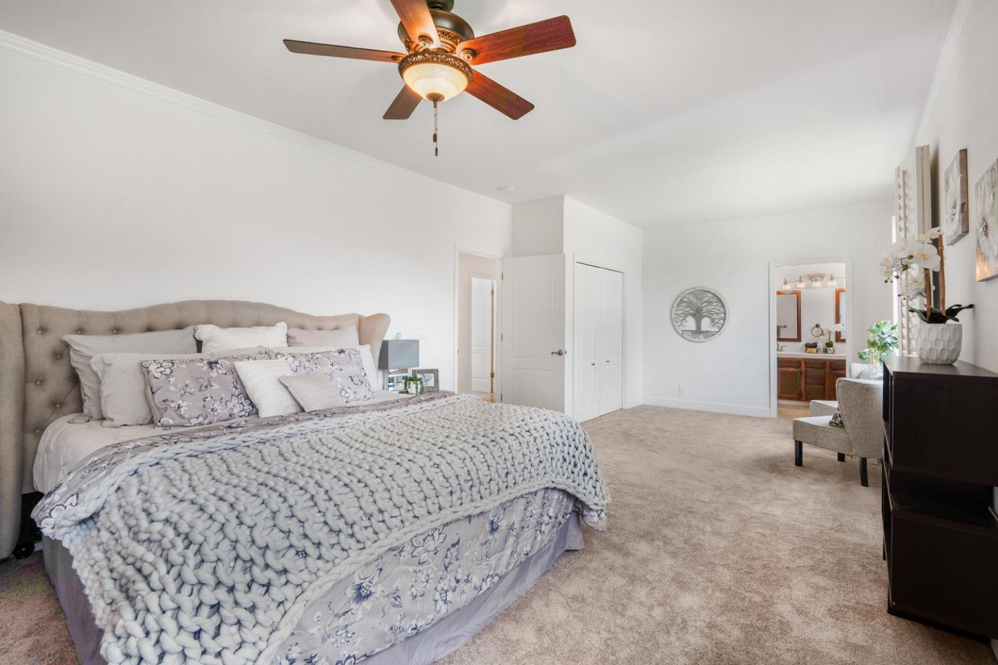 9040 Ridgeway Drive Gilroy, CA 95020 - Photo 27 of 44 a bedroom with a bed and a chandelier