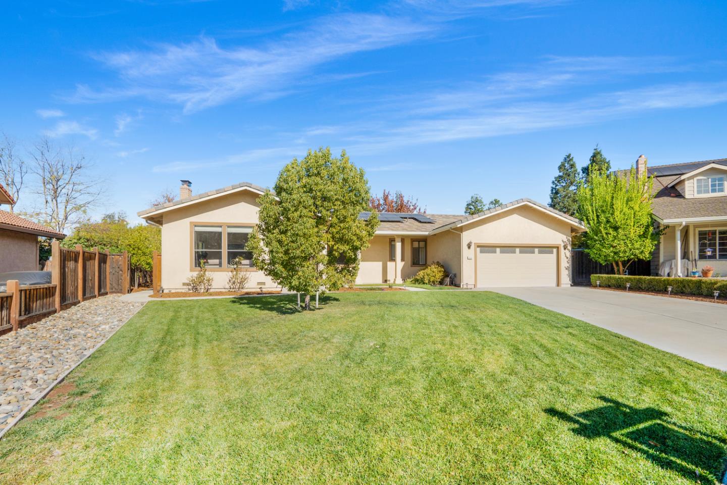 9040 Ridgeway Drive Gilroy, CA 95020 - Photo 3 of 44 a front view of a house with a yard and garage