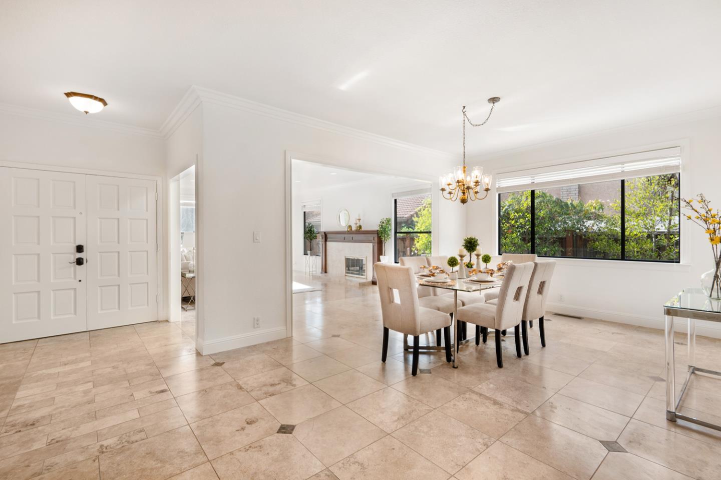 9040 Ridgeway Drive Gilroy, CA 95020 - Photo 6 of 44 a dining room with furniture a chandelier and a rug