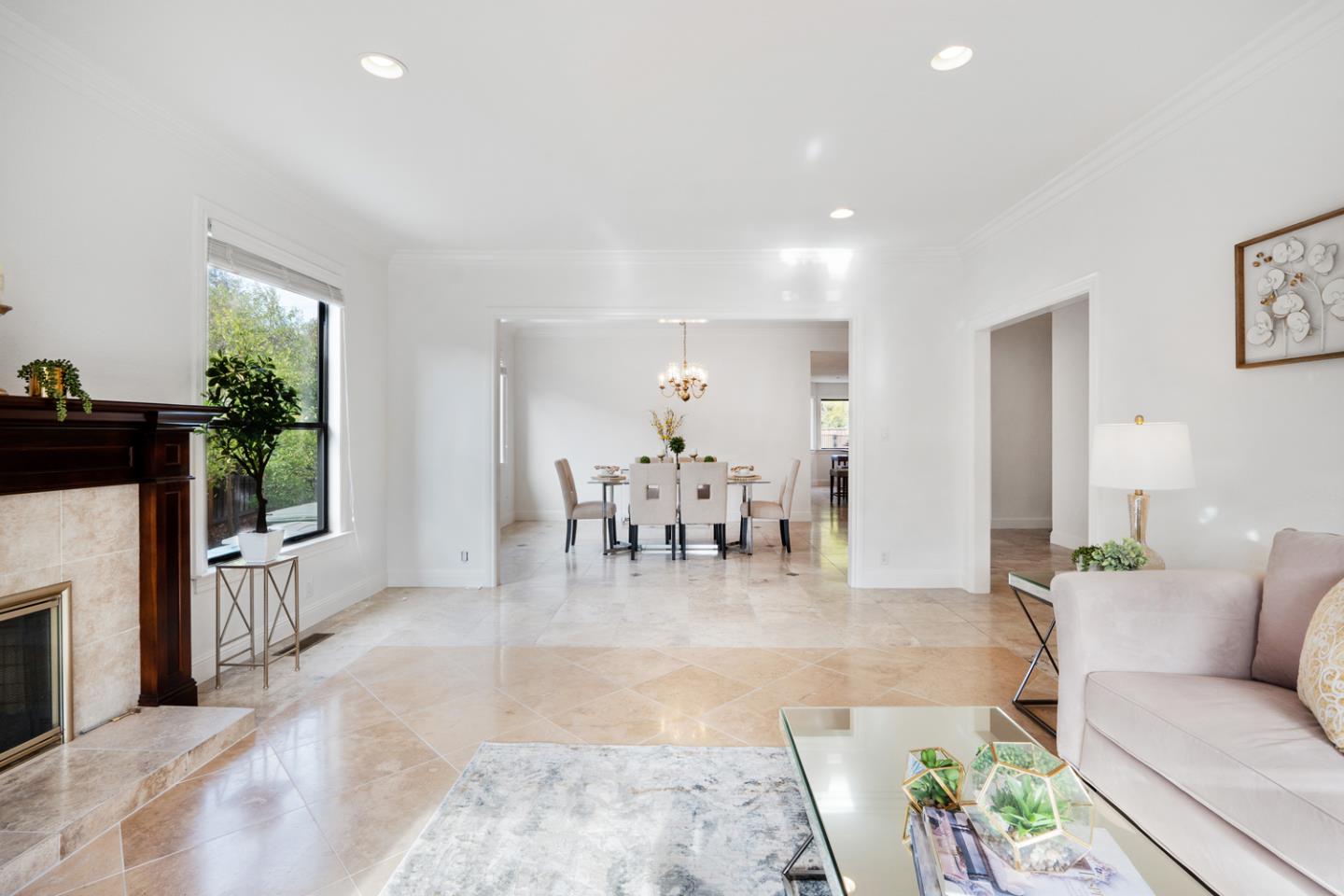 9040 Ridgeway Drive Gilroy, CA 95020 - Photo 8 of 44 a living room with furniture a fireplace and a dining table with garden view