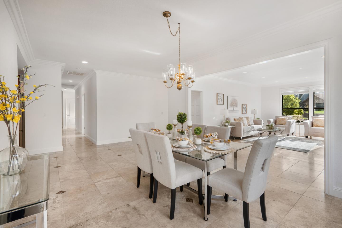 9040 Ridgeway Drive Gilroy, CA 95020 - Photo 9 of 44 a view of a dining room with furniture and a chandelier