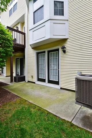 a view of a white building with many windows