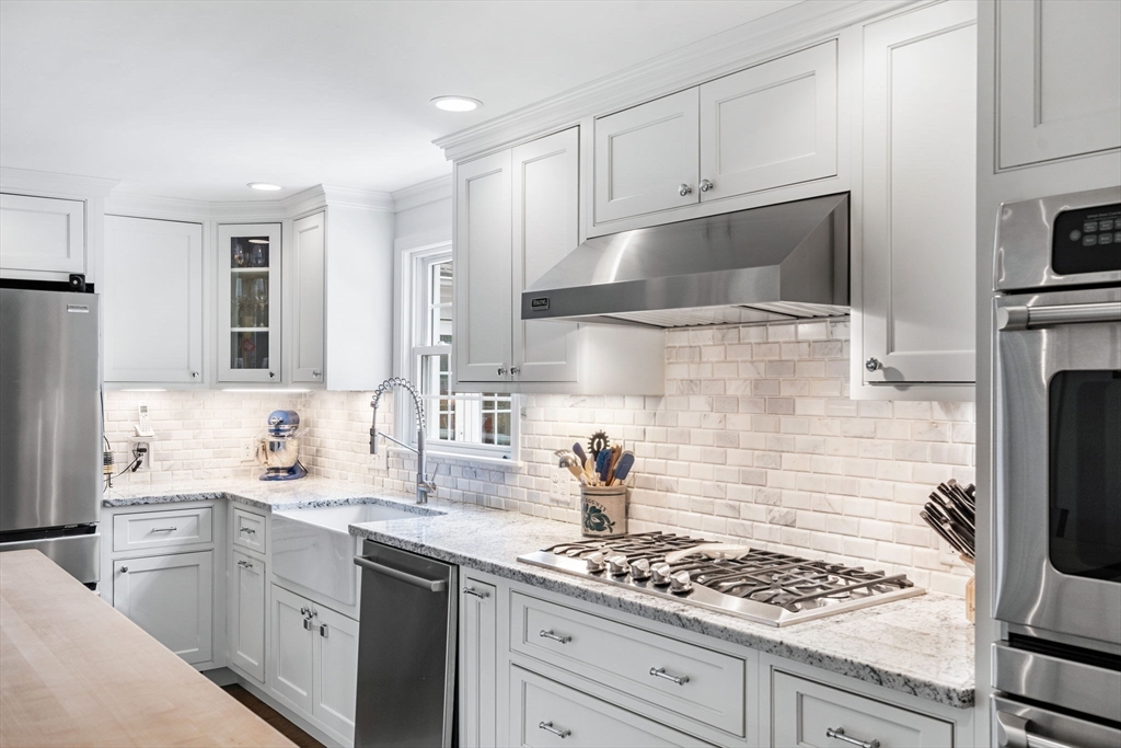 3 Wilmor Road Topsfield, MA 01983 - Photo 3 of 33 a kitchen with white cabinets and appliances