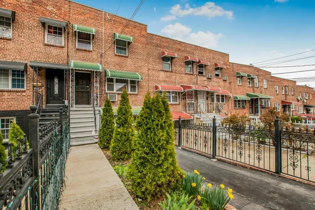 a front view of a building with glass windows and door