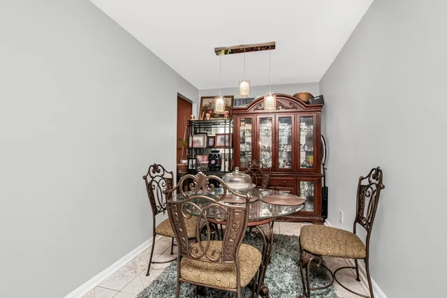 a view of a room with furniture and wooden floor