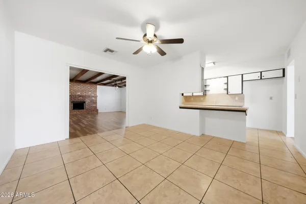 a bedroom with a bed and a walk in closet with window