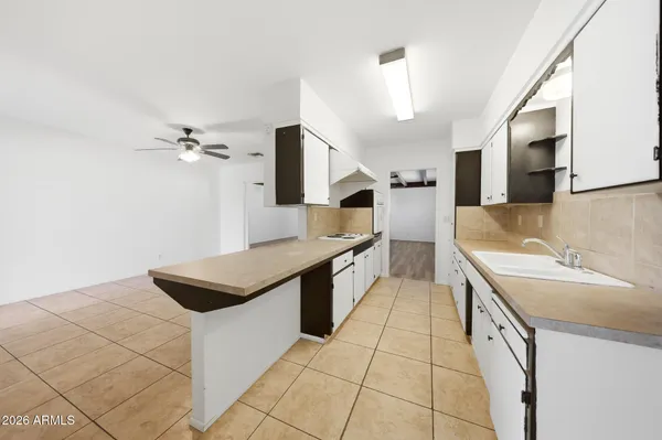 a kitchen with stainless steel appliances a sink and a stove