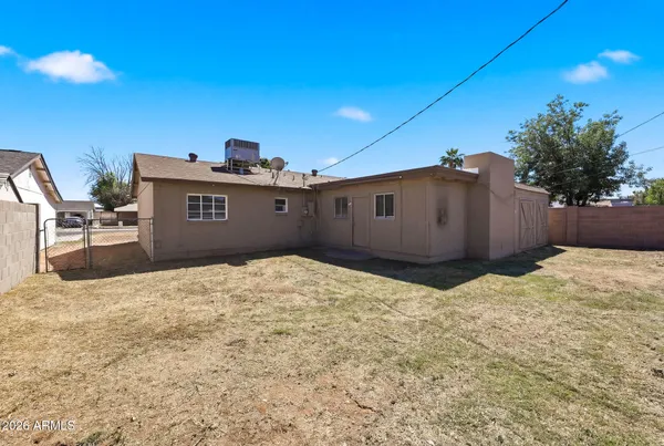 a house view with a backyard space