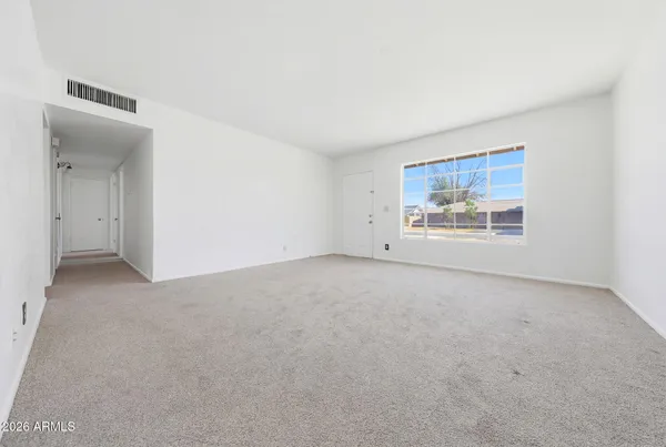 an empty room with windows