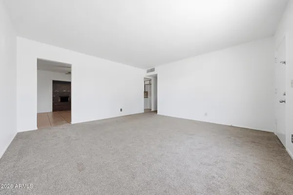 a view of an empty room and closet