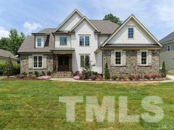5527 Alpine Drive Raleigh, NC 27609 - Photo 8 of 15 a front view of a house with a yard