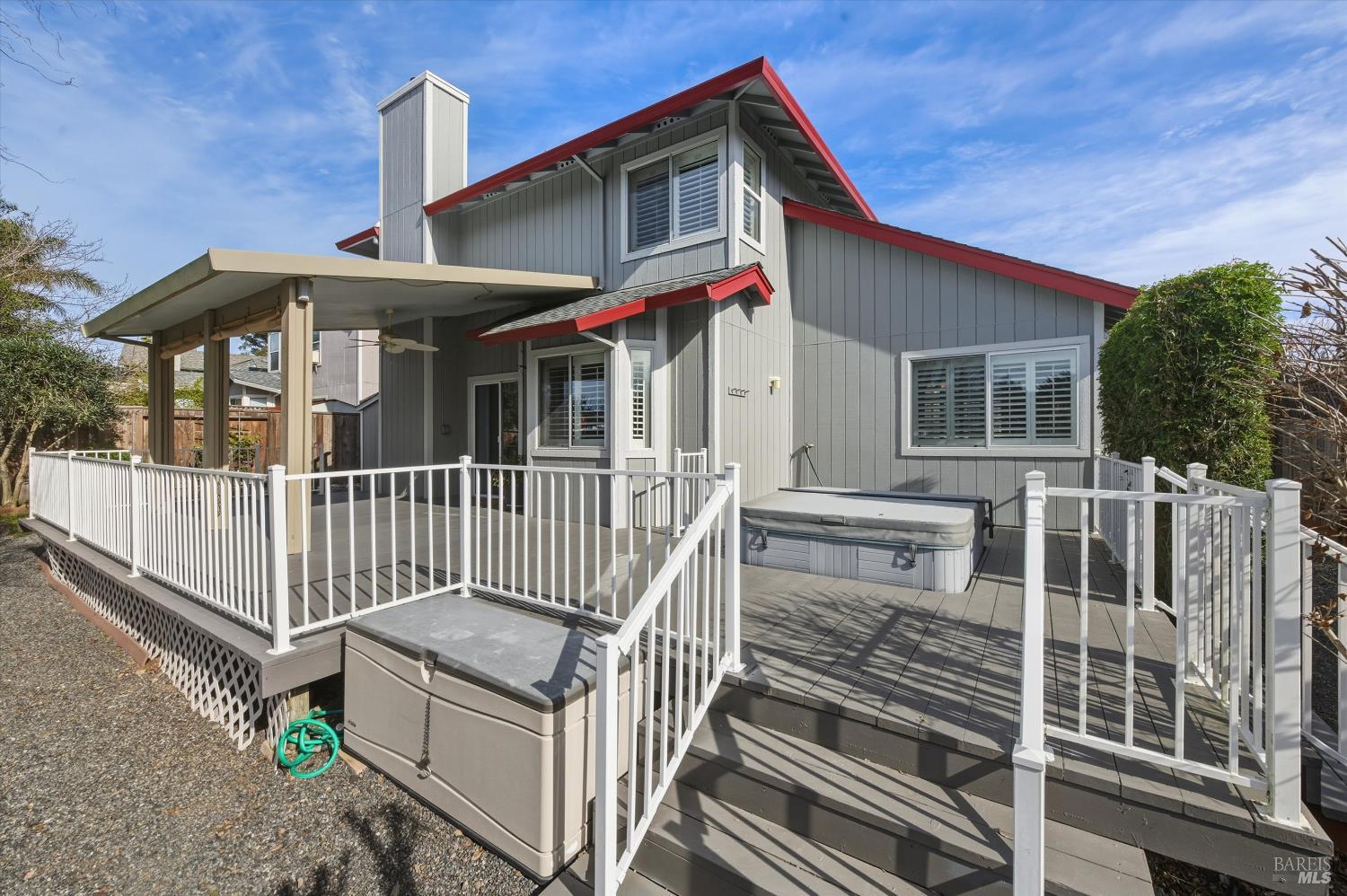 8873 Lebec Lane Cotati, CA 94931 - Photo 32 of 49 Summer living is a breeze on this deck, shade provided by commercial grade construction with a 3-inch foam roof encased in aluminum. Relax in your hot tub included in sale.