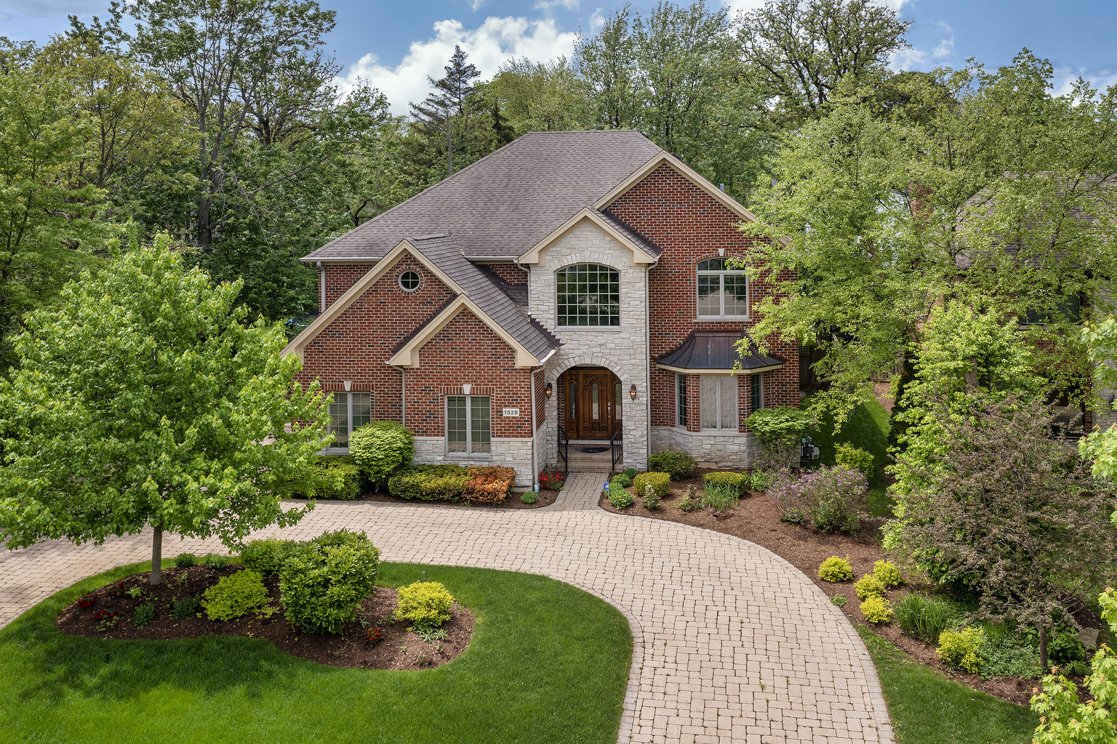 1528 Stratford Road Deerfield, IL 60015 - Photo 1 of 25 a front view of a house with a yard