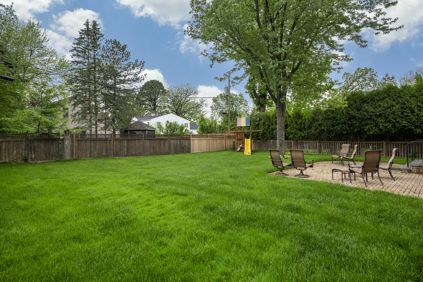 1528 Stratford Road Deerfield, IL 60015 - Photo 20 of 25 a view of backyard with sitting area and slide