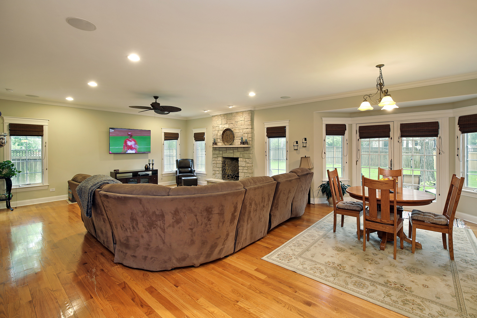 1528 Stratford Road Deerfield, IL 60015 - Photo 7 of 25 a living room with furniture a dining table and chairs with wooden floor