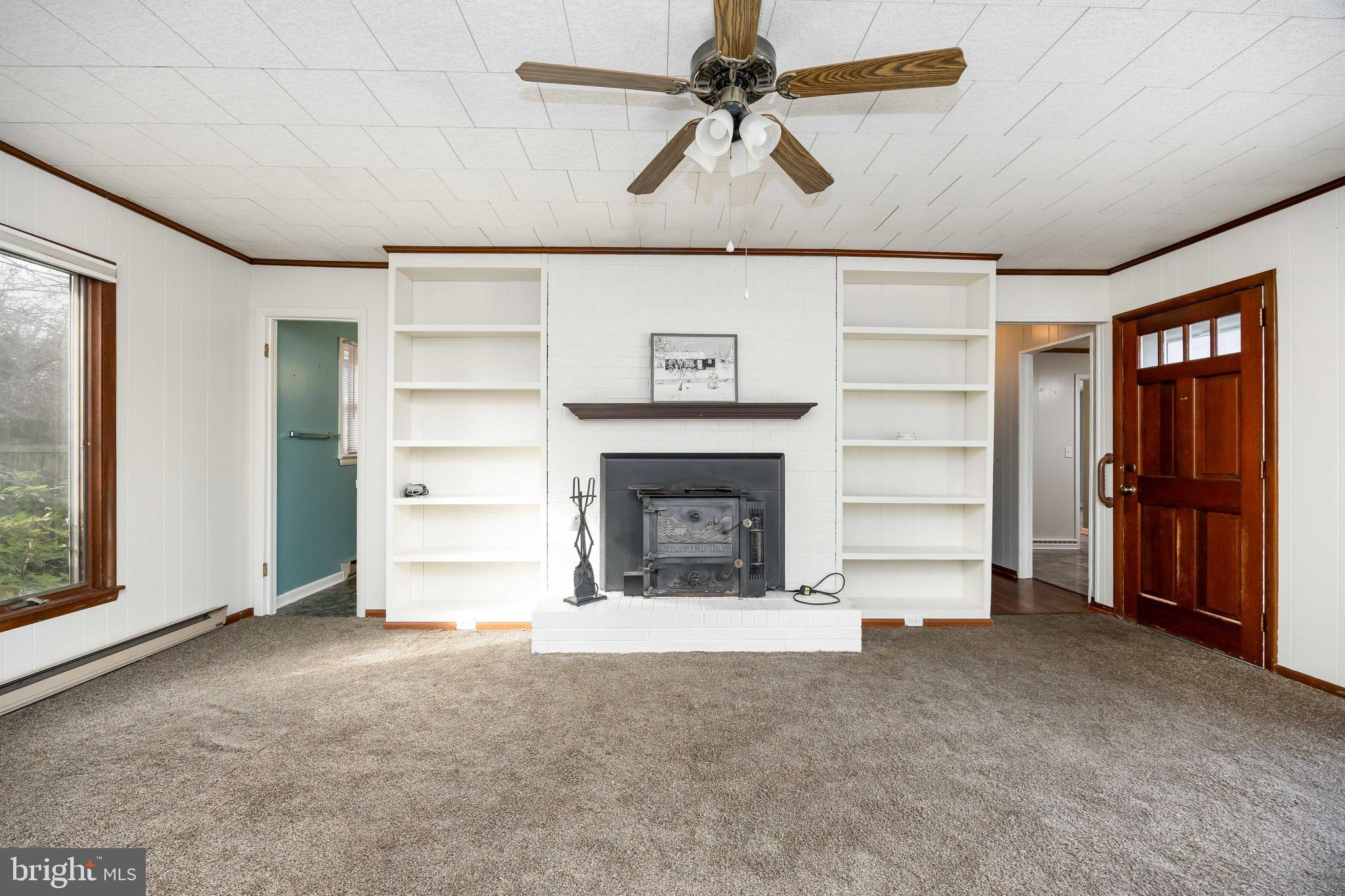 310 Zion Road Salisbury, MD 21804 - Photo 15 of 40 a view of an empty room with a fireplace and a window