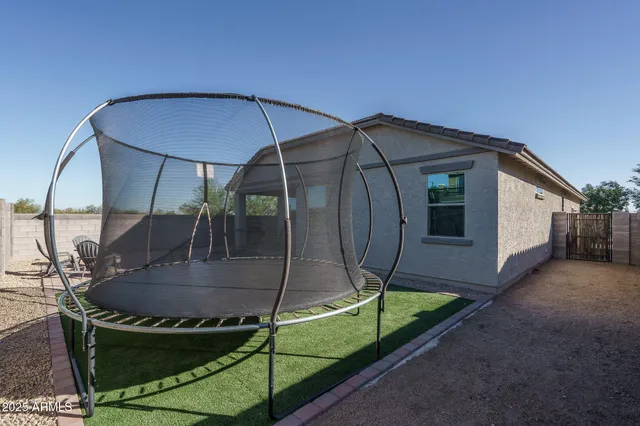 a view of a backyard with a slide