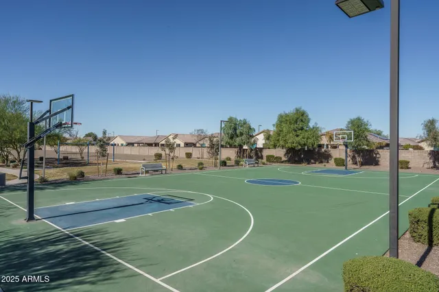 a view of a patio with dining table and chairs with a small yard