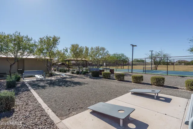 a view of a roof deck with couches and wooden floor