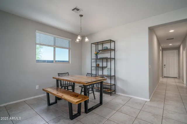 a kitchen with kitchen island granite countertop a sink appliances and cabinets