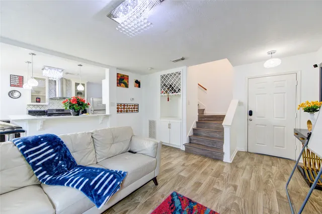 a bed room with furniture and a flat screen tv