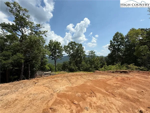 a view of a lake with a building in the background