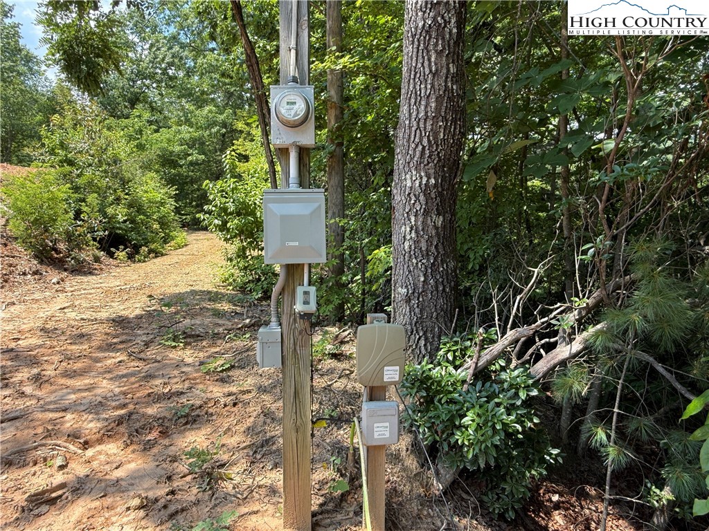 337 Lucas Path Drive Purlear, NC 28665 - Photo 22 of 48 a sign that is on a tree in front of a house