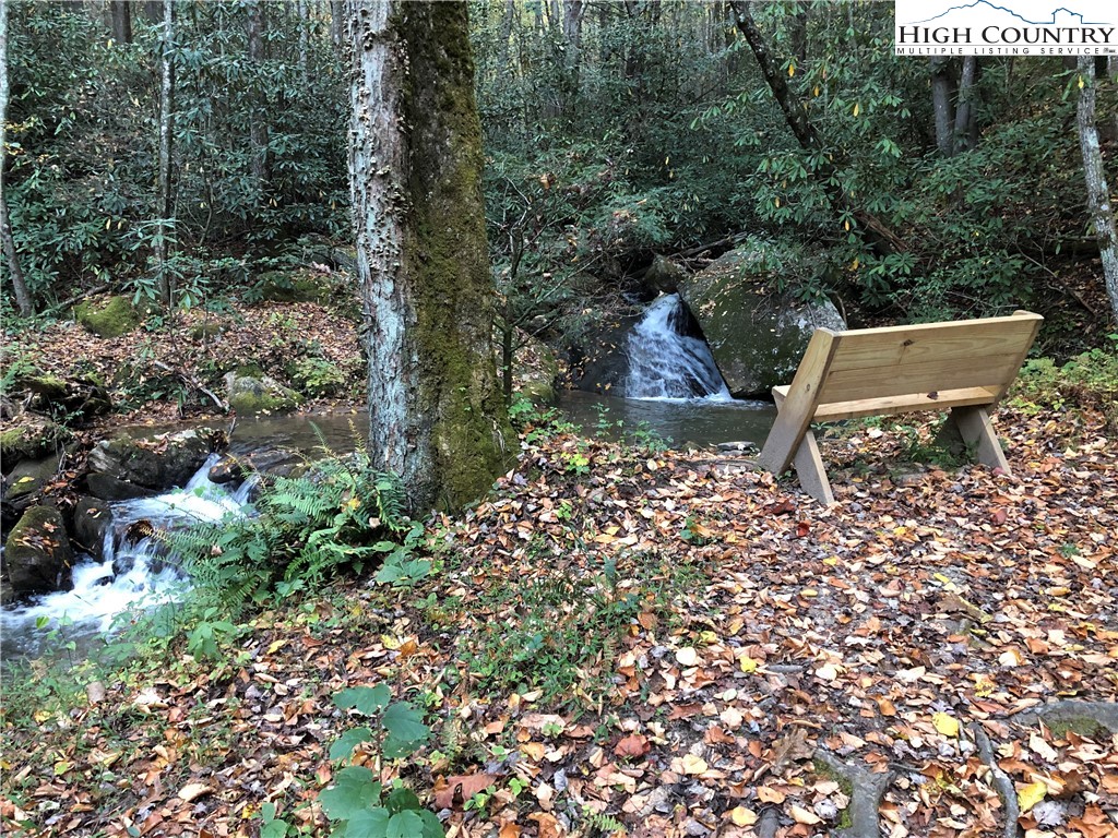 337 Lucas Path Drive Purlear, NC 28665 - Photo 35 of 48 a view of a bench in the garden