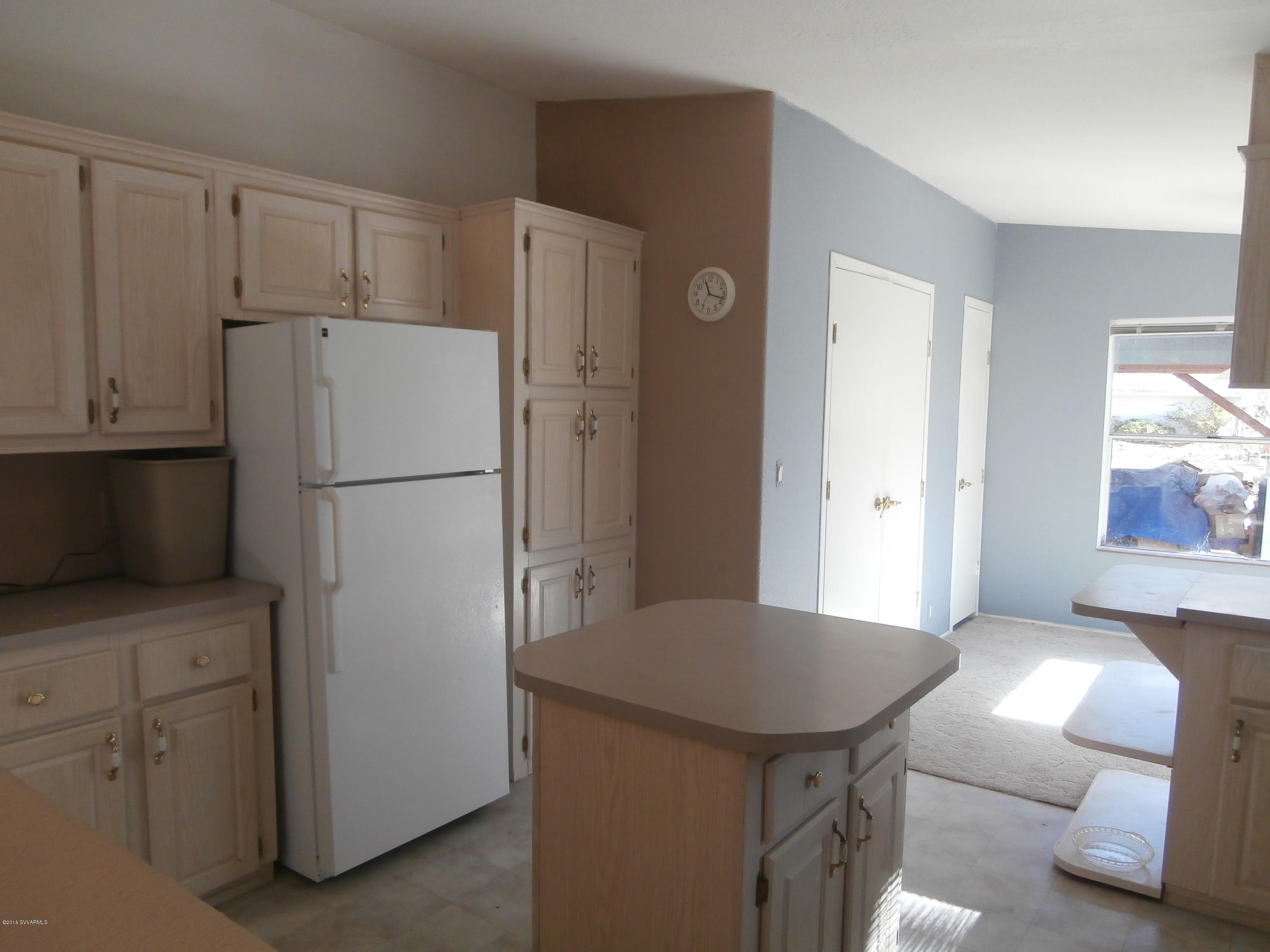 4305 East Aztec Road Rimrock, AZ 86335 - Photo 18 of 25 a kitchen with cabinets and stainless steel appliances