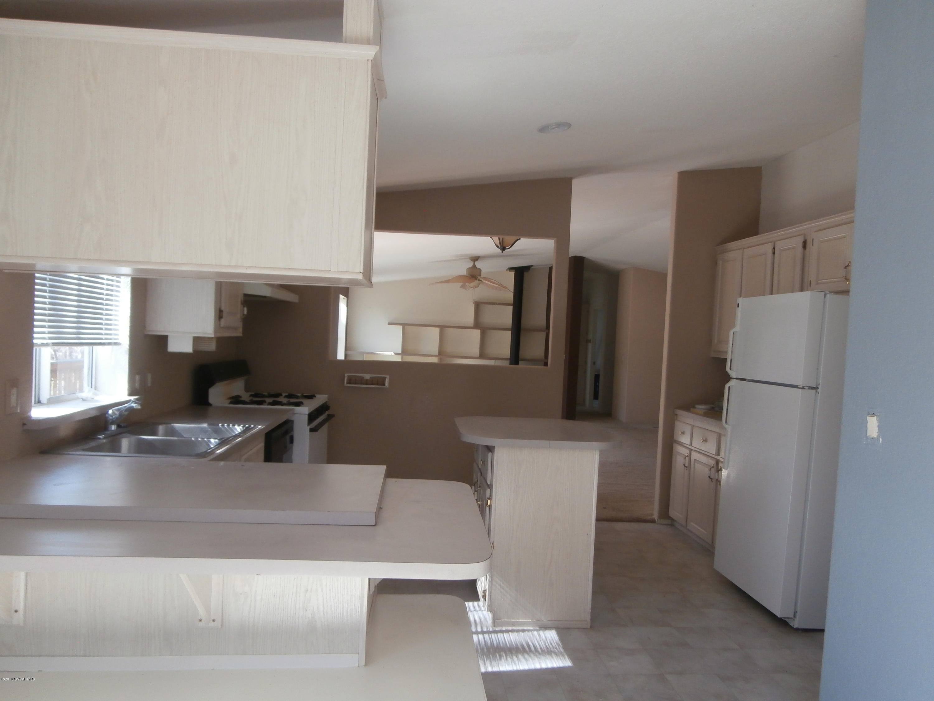 4305 East Aztec Road Rimrock, AZ 86335 - Photo 19 of 25 a living room with a couch and a flat screen tv