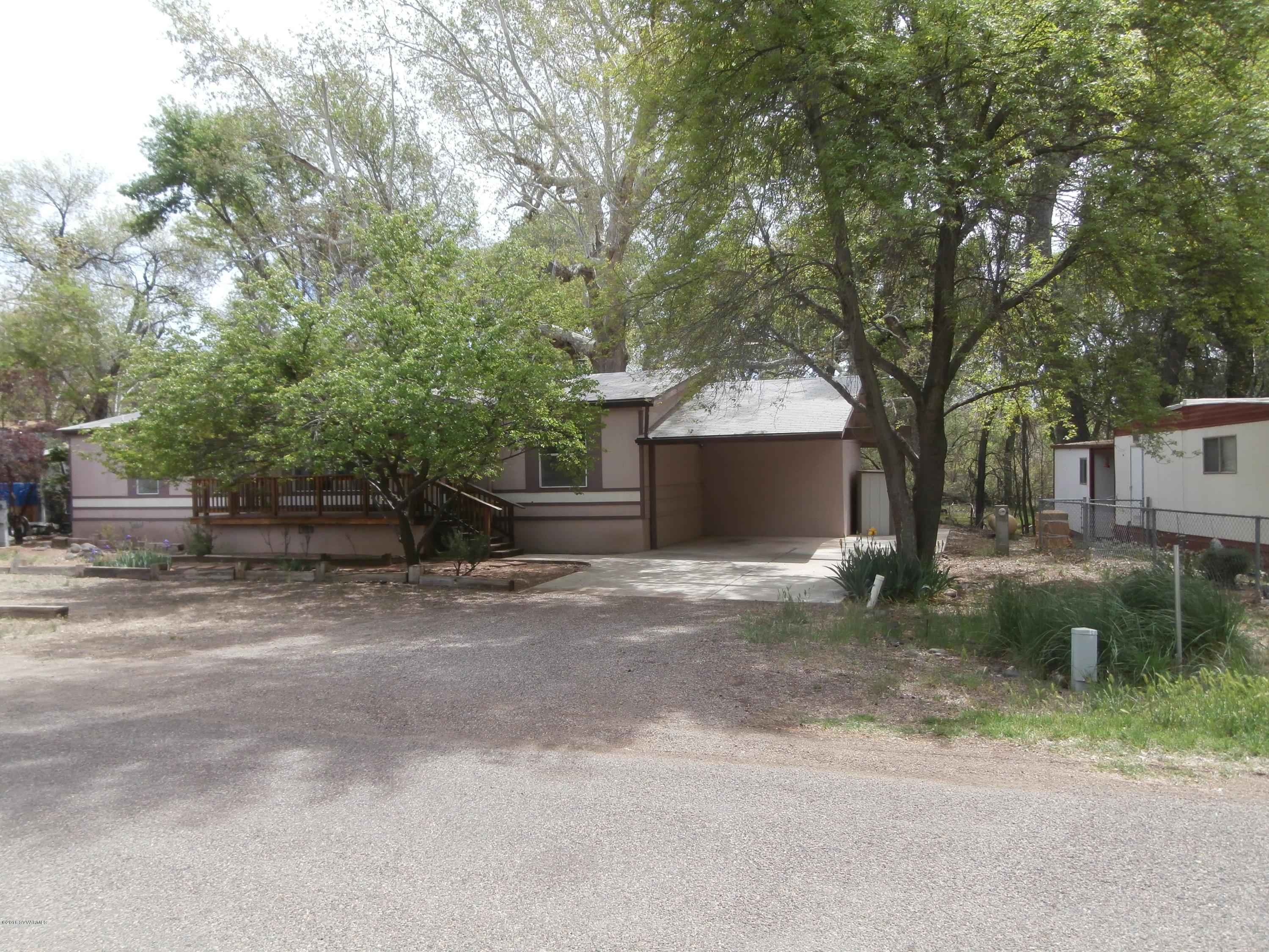 4305 East Aztec Road Rimrock, AZ 86335 - Photo 2 of 25 a front view of a house with a yard and a garage