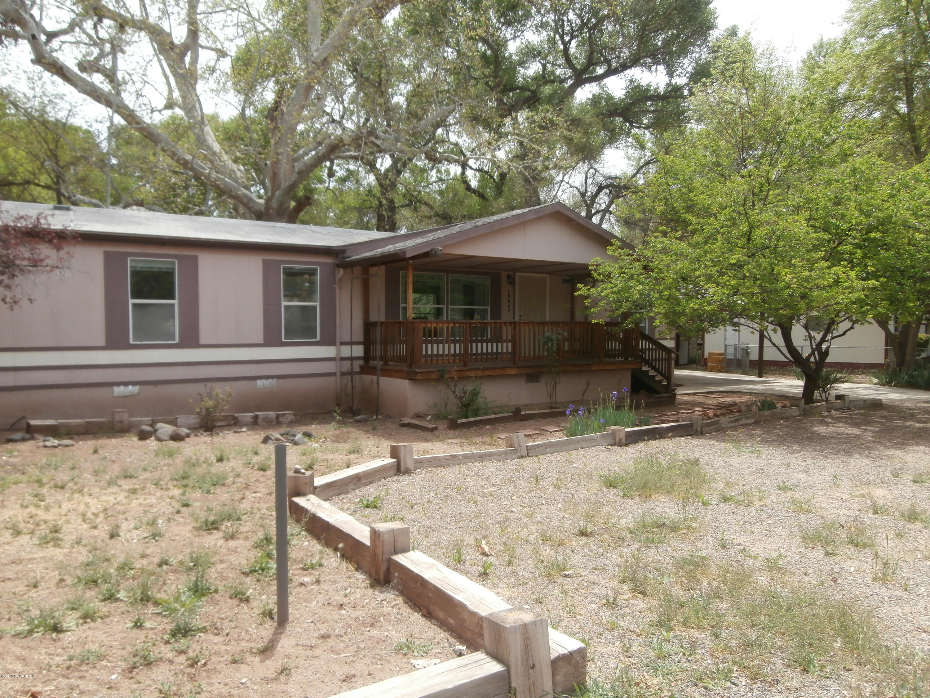 4305 East Aztec Road Rimrock, AZ 86335 - Photo 3 of 25 a front view of a house with garden