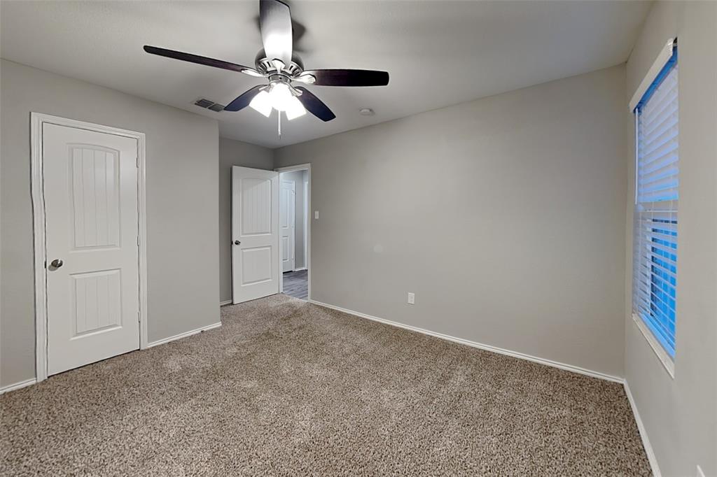 5529 McClelland Street Forney, TX 75126 - Photo 11 of 16 a view of an empty room and chandelier fan