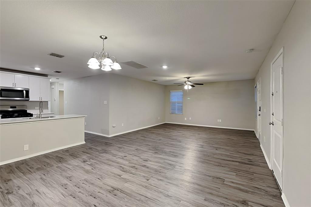 5529 McClelland Street Forney, TX 75126 - Photo 5 of 16 a view of a kitchen with microwave and stove