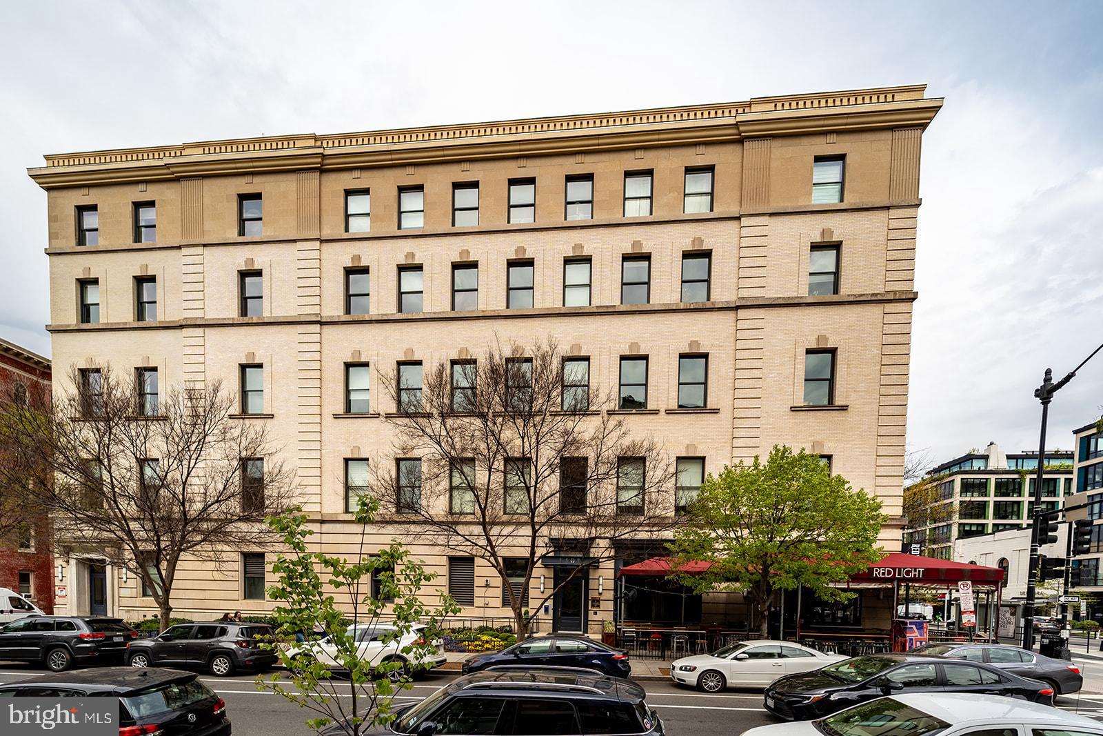 1401 R Street Northwest, Unit 406 Washington, DC 20009 - Photo 2 of 22 a front view of a building with lot of cars
