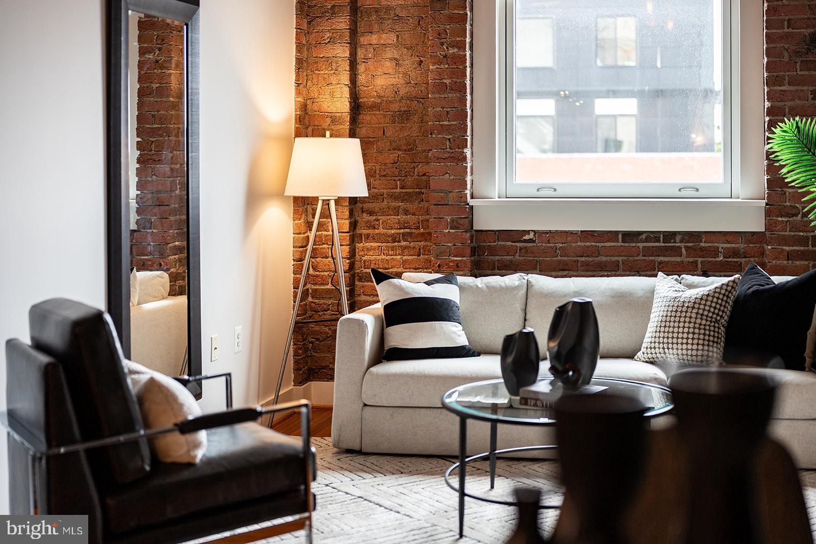 1401 R Street Northwest, Unit 406 Washington, DC 20009 - Photo 4 of 22 a living room with furniture and a window